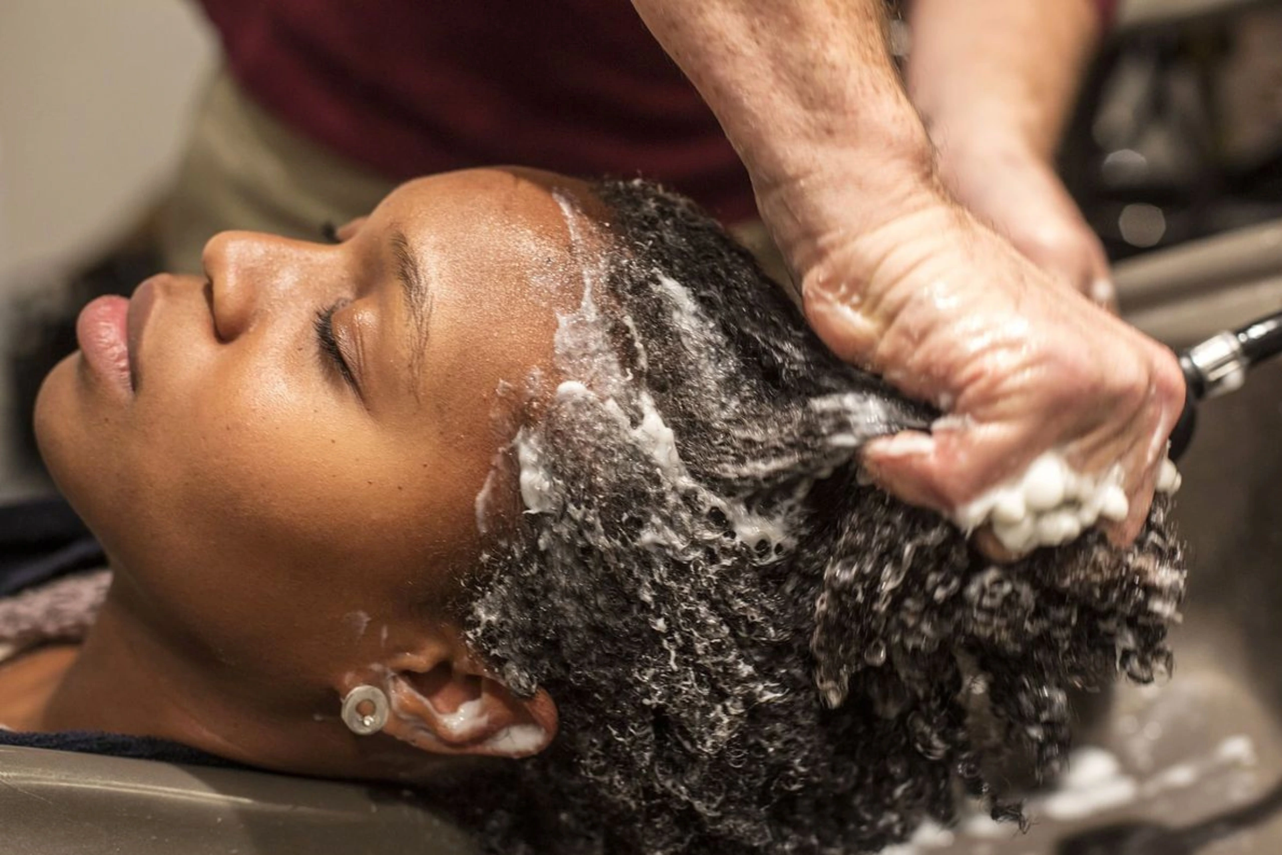 Scalp cleansing wash service at Wash Bar supporting protective style readiness.