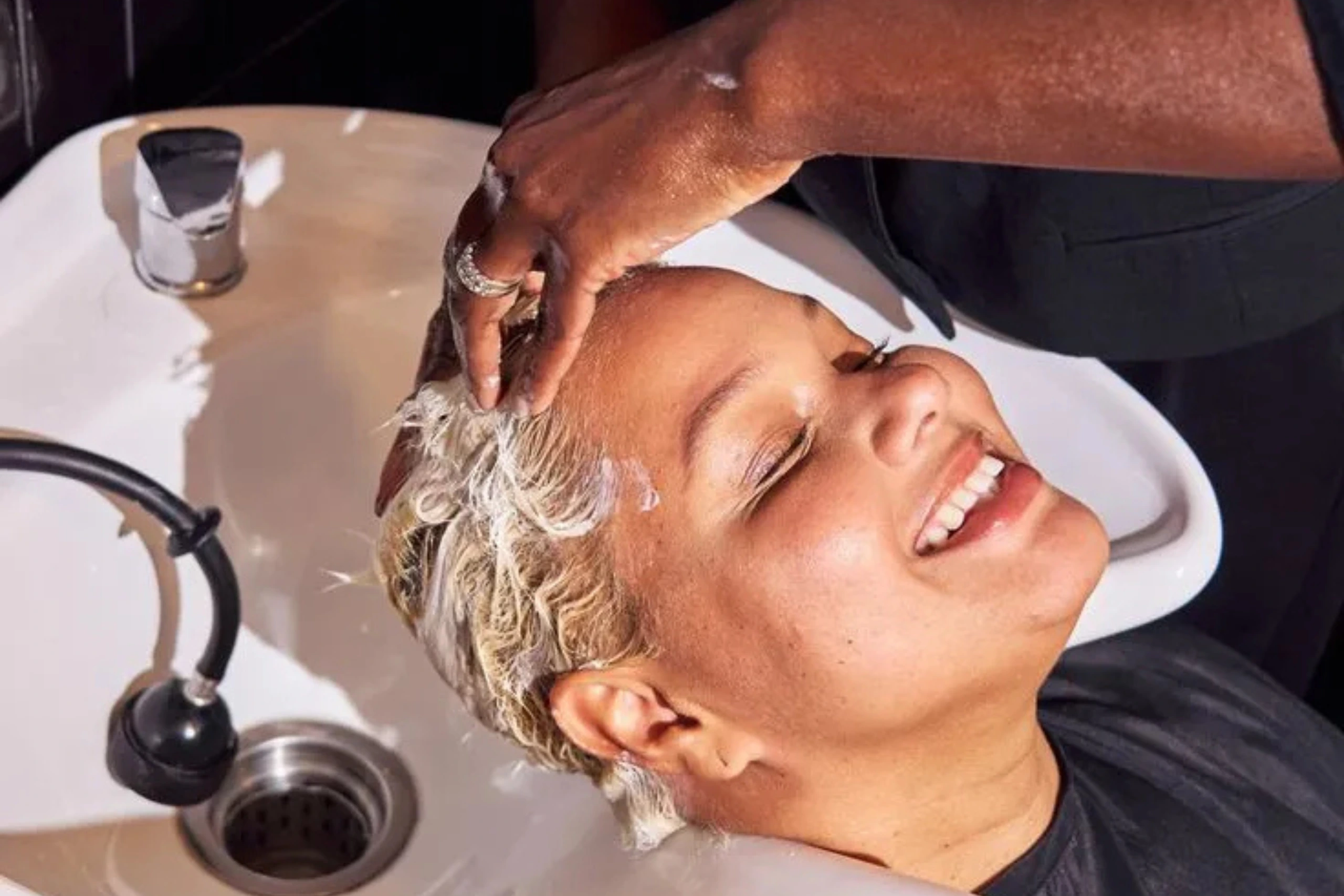 Wash Bar hair wash station designed for healthy cleansing, hydration, and protective style prep.